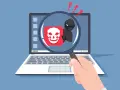 Lupa amplía un icono de calavera sonriente y un hacker, indicando la amenaza del virus Melissa.