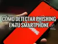Mano sujetando un smartphone con pantalla roja que muestra "CÓMO DETECTAR PHISHING EN TU SMARTPHONE". Aprende cómo saber si tengo phishing en el móvil.