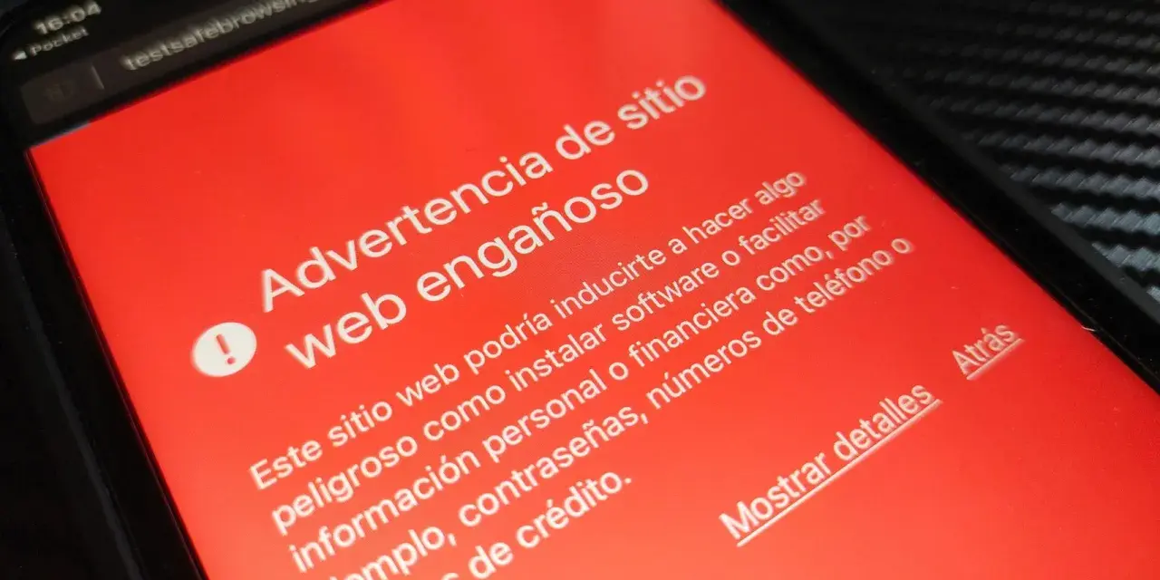Alerta de advertencia en pantalla roja: "Advertencia de sitio web engañoso". Ayuda a comprobar web fraudulenta.