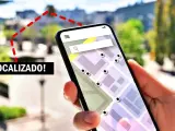 Mano sujetando un móvil con mapa y puntos de localización. ¡Localizado! se puede saber la ubicación de un móvil.